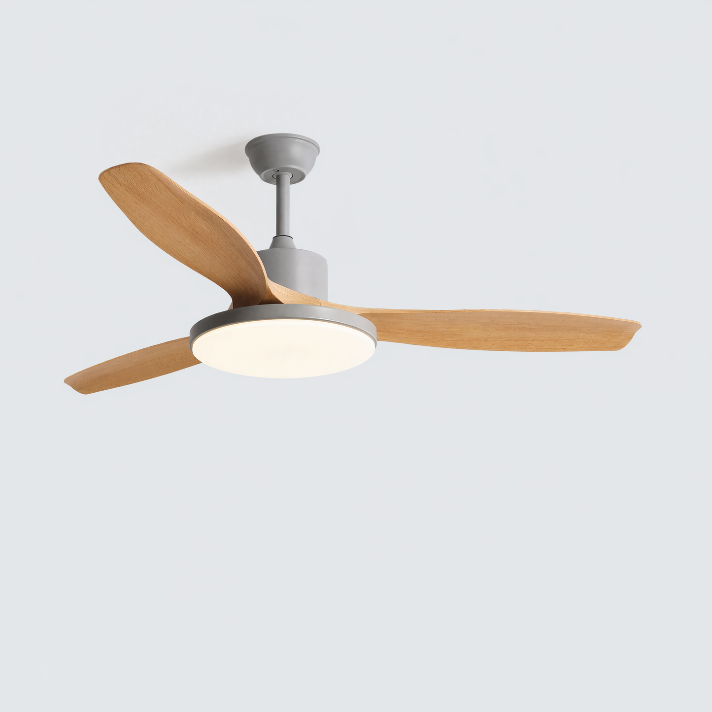 Grey motor version of a 3 blade ceiling fan with wood blades and integrated LED light, made for calm neutral interiors and understated modern rooms.