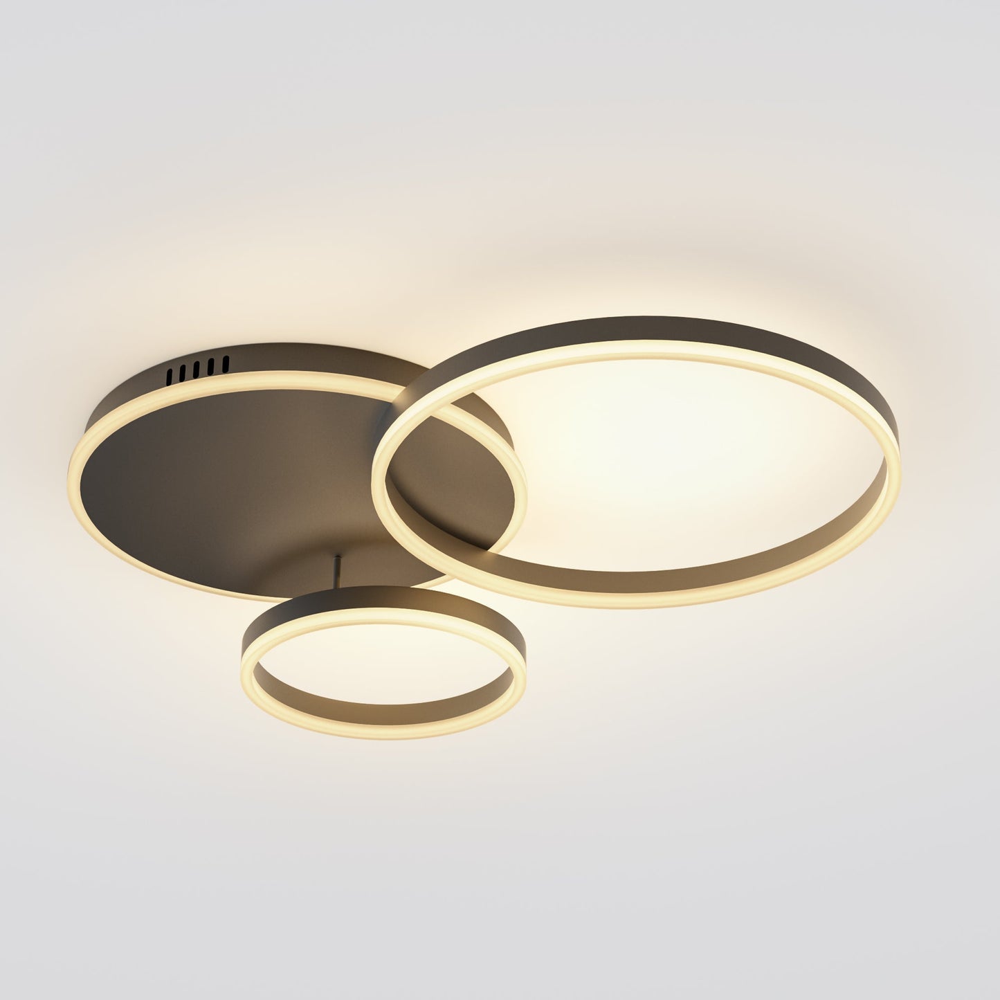 A black led ceiling light fixture with layered circular rings, offering the impact of a statement light in a ceiling-hugging design.