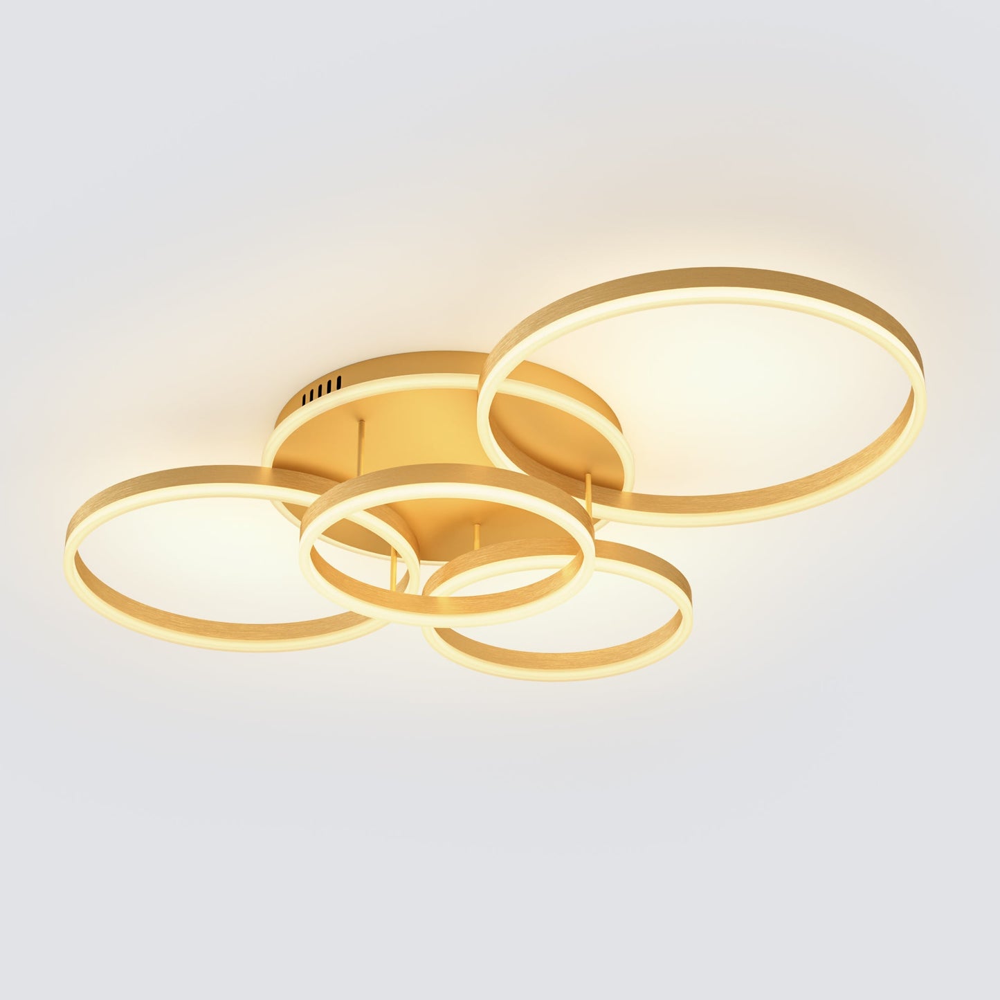 A gold five-ring dining room light fixtures design with layered circular LED forms, adding warm brightness and a refined centerpiece feel to the room.