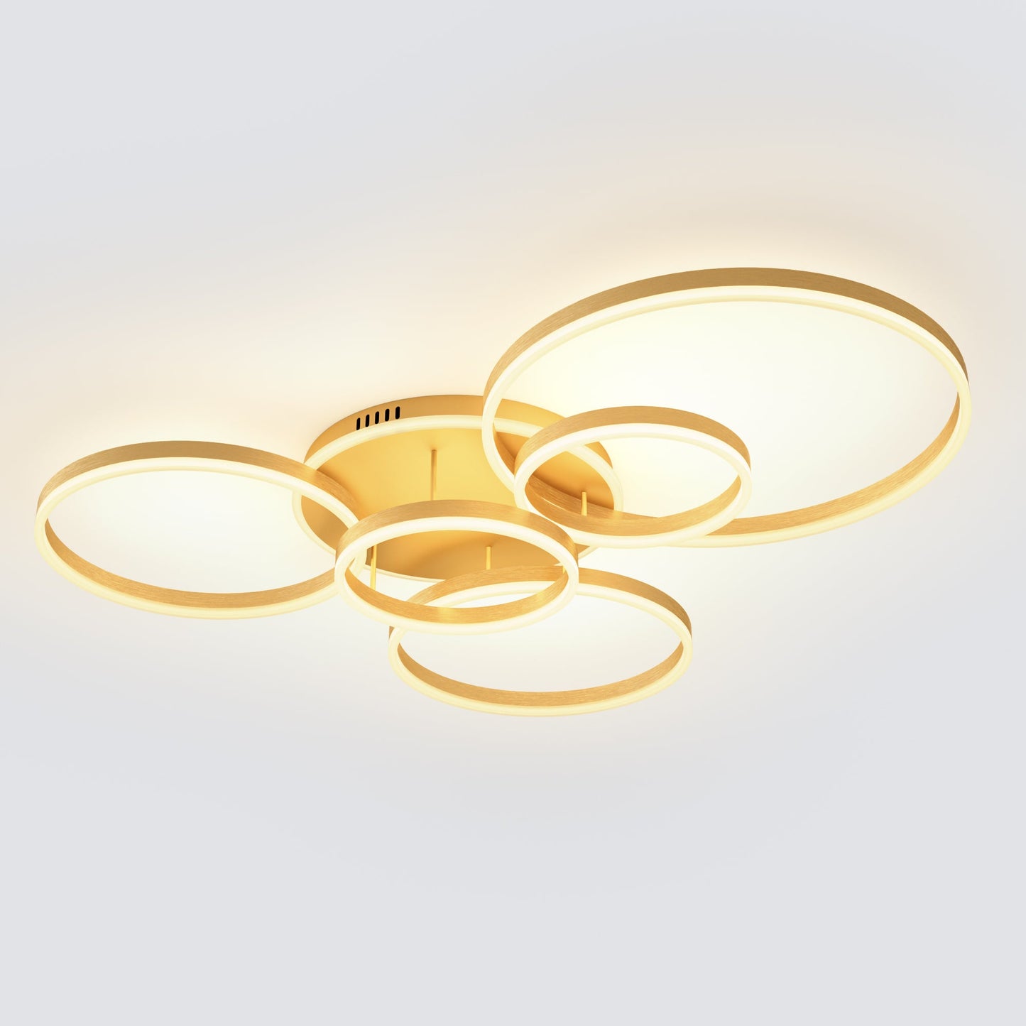 A large gold flush mount ceiling light with six overlapping LED rings, creating a bright, elegant focal point for spacious living rooms, dining areas, or open-plan interiors.