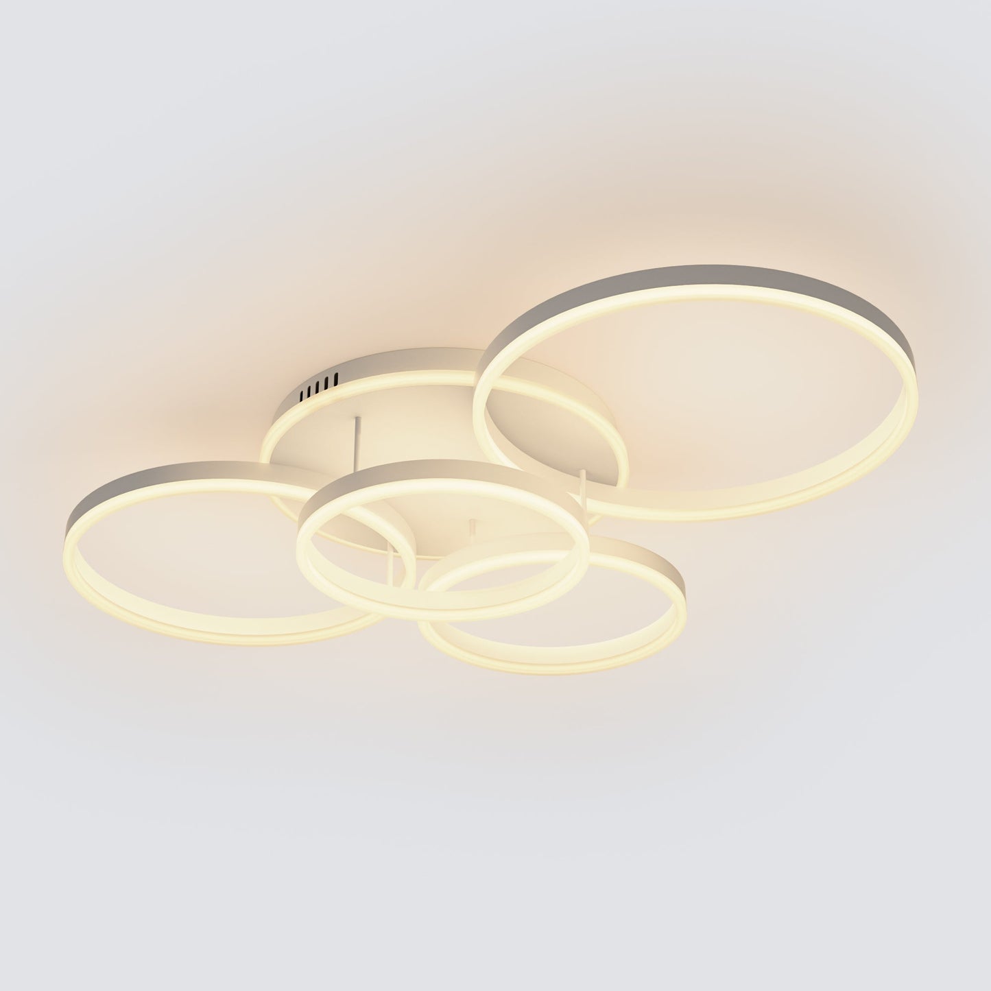 A soft white overhead lighting fixture with five circular LED rings, bringing gentle brightness to bedrooms, lounges, or relaxed family spaces.