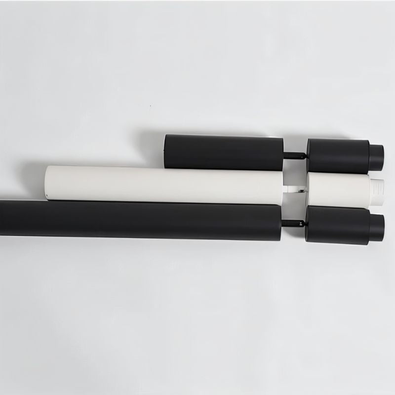 Adjustable curtain rod with black and white cylindrical finials and gray bracket hardware on white background.