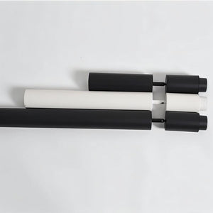 Adjustable curtain rod with black and white cylindrical finials and gray bracket hardware on white background.