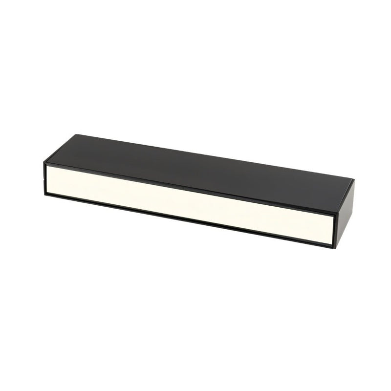 Black rectangular LED downlight with cream-colored diffuser on white background.