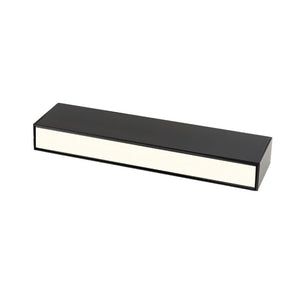 Black rectangular LED downlight with cream-colored diffuser on white background.
