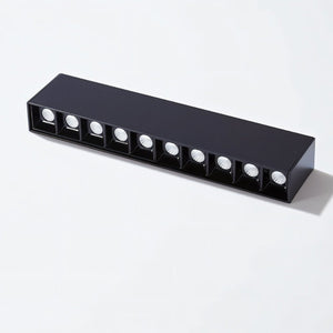 Black rectangular recessed downlight fixture with eight integrated LED lights on white background.
