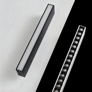 Sleek black linear downlight fixture displayed on white and black background surfaces.