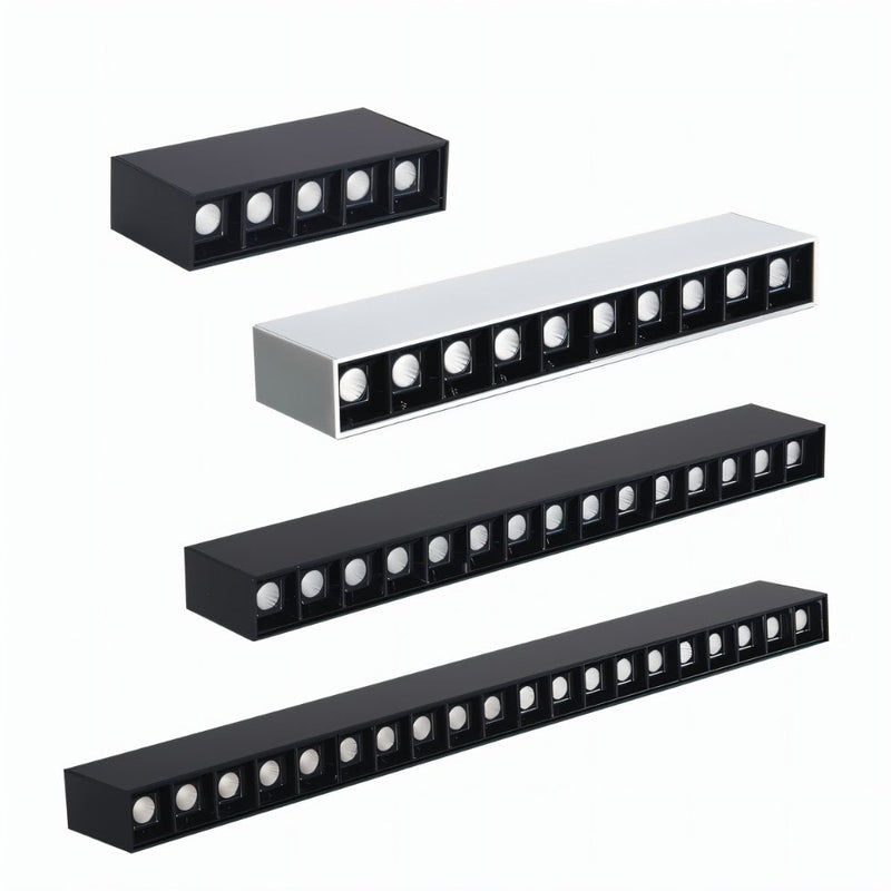 Four linear black and white recessed downlight fixtures arranged in descending size order on white background.