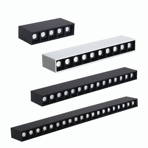 Four linear black and white recessed downlight fixtures arranged in descending size order on white background.