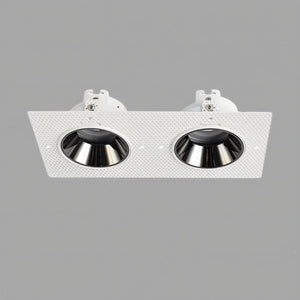 White rectangular recessed downlight with two black metal reflector cups on gray background.