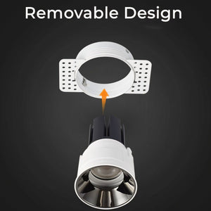Trimless recessed downlight with white finish and removable ring design shown disassembled on dark background.