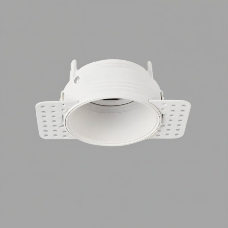 White recessed downlight with adjustable trim and mounting brackets on gray background.