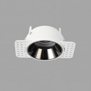 White recessed downlight with black reflector and adjustable trim flanges on gray background.
