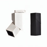 White and black adjustable track light fixtures shown on white background.