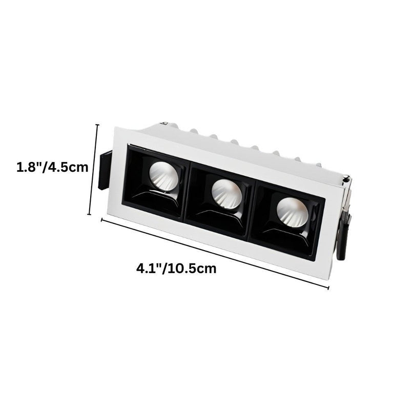 White and black recessed downlight fixture with three adjustable LED spotlights on white background.