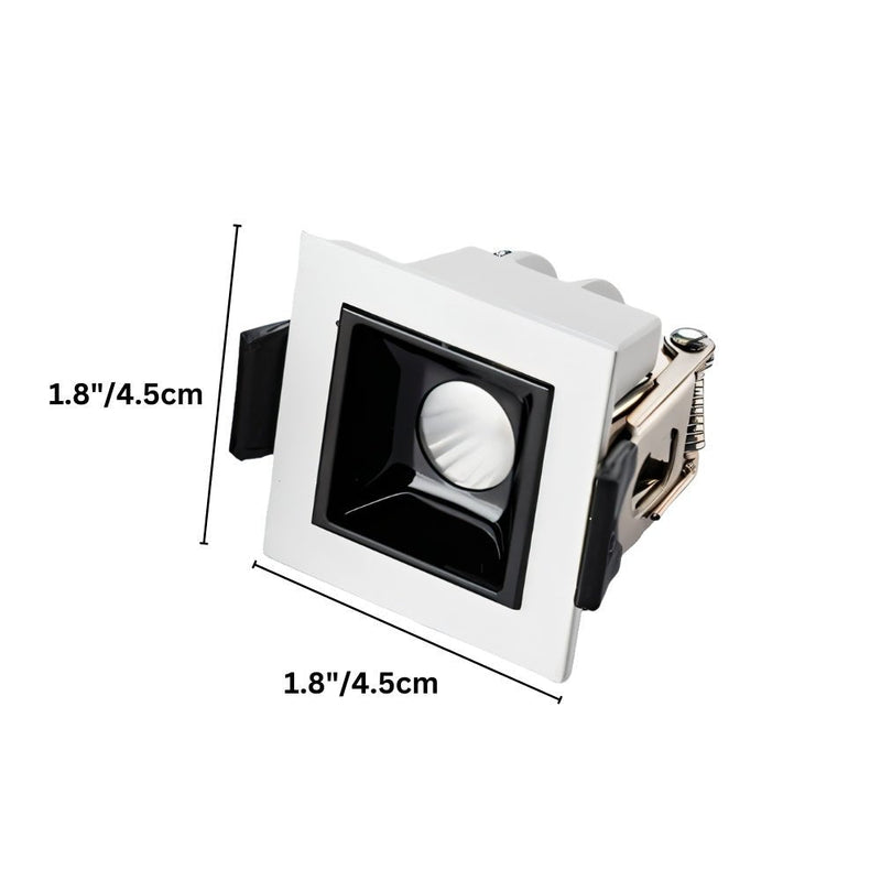Small square white and black recessed downlight fixture with adjustable trim ring, shown against white background.