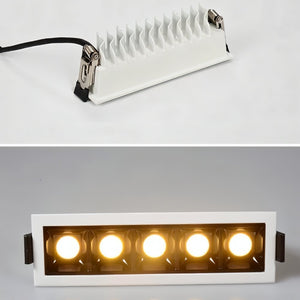 White recessed downlight with five warm LED bulbs and aluminum heat sink, shown lit against gray background.
