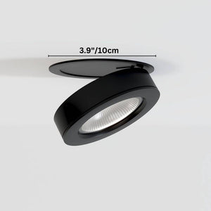 Black adjustable downlight fixture with ribbed lens shown installed in ceiling, 3.9 inches diameter.